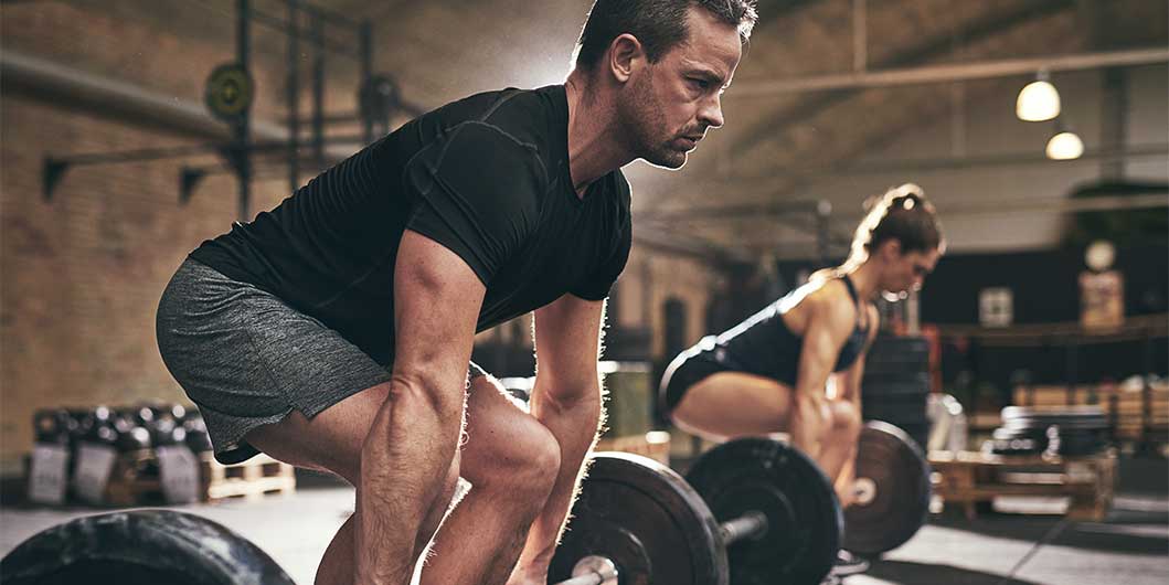 Man lifting weights in the gym