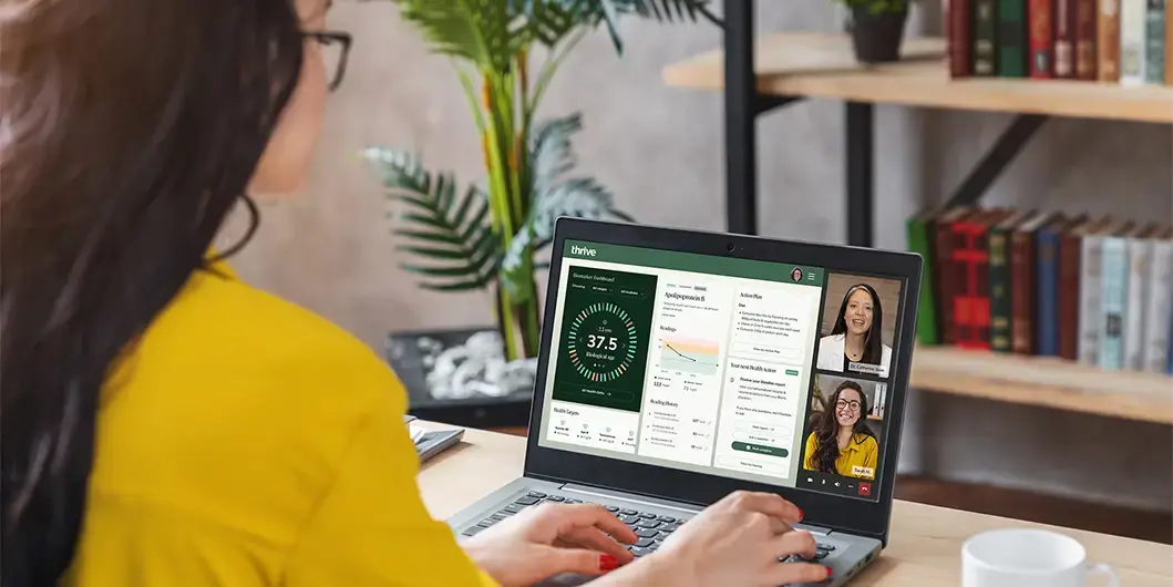 Woman reviewing her biomarker test results with a physician over a video call